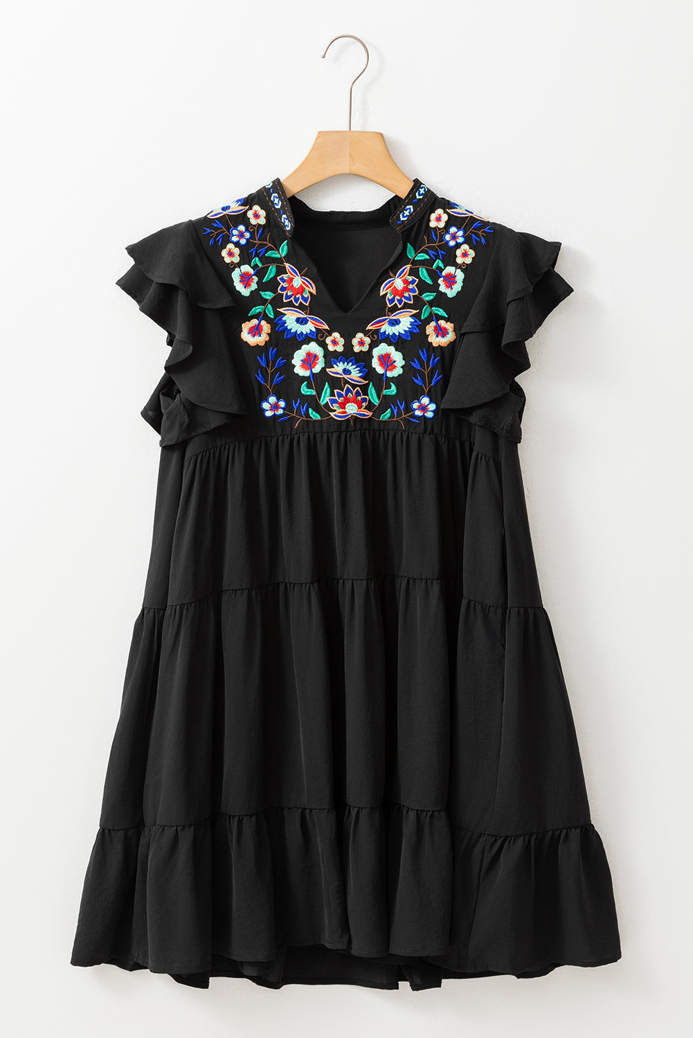 Black mini dress with embroidered flowers and layered ruffles