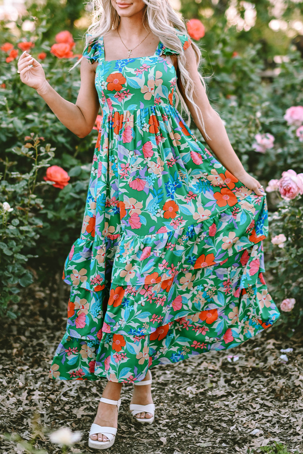 Pink sleeveless maxi dress with floral print and ruffles