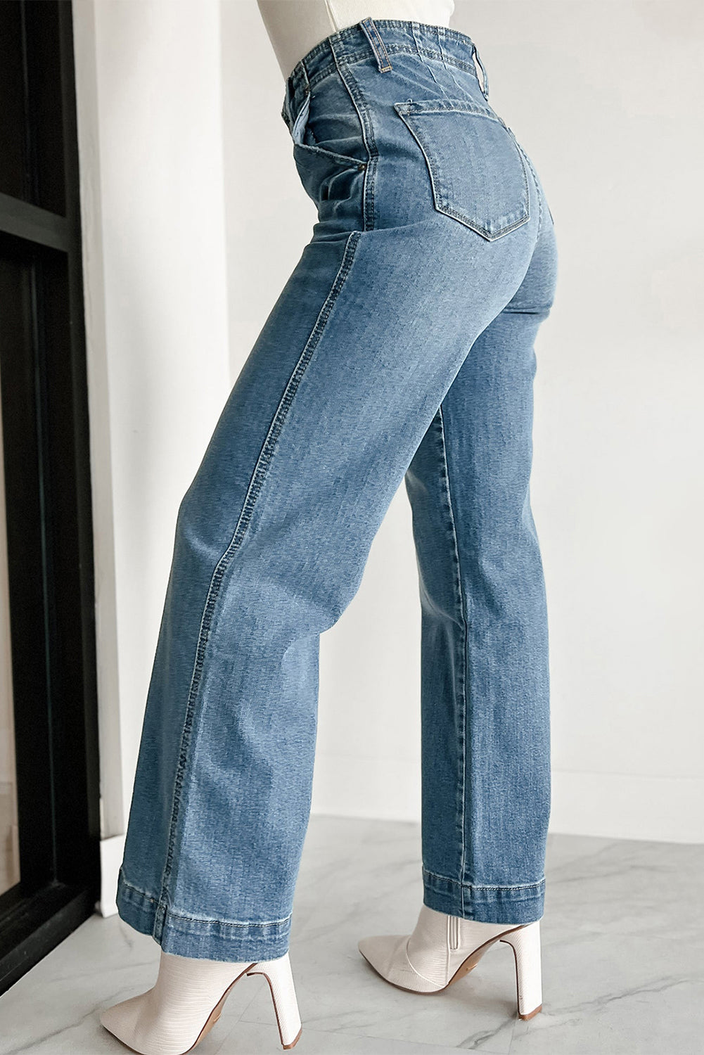 Dark blue jeans with multiple buttons