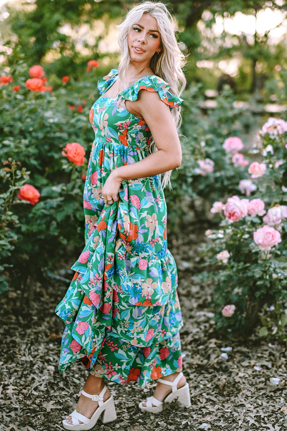 Pink sleeveless maxi dress with floral print and ruffles