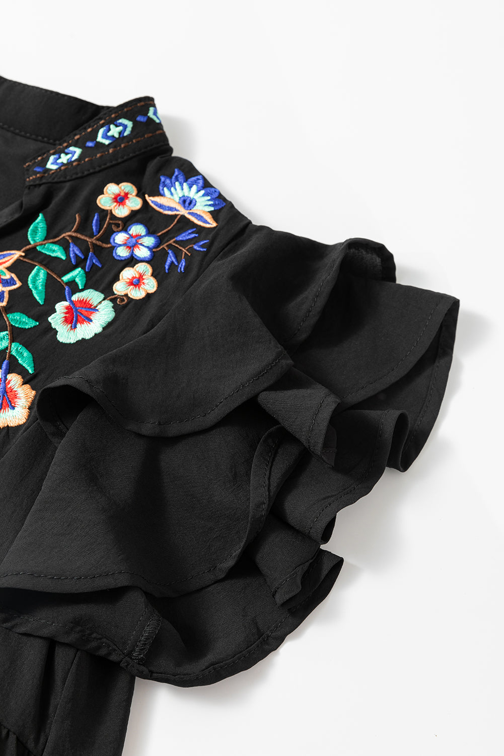 Black mini dress with embroidered flowers and layered ruffles