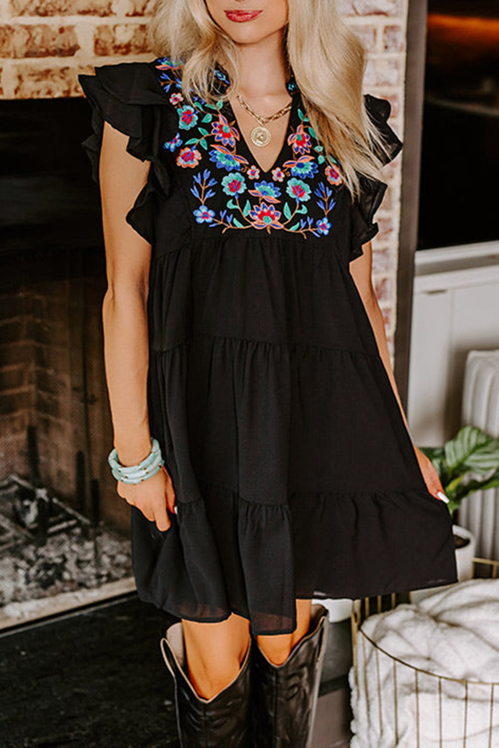 Black mini dress with embroidered flowers and layered ruffles