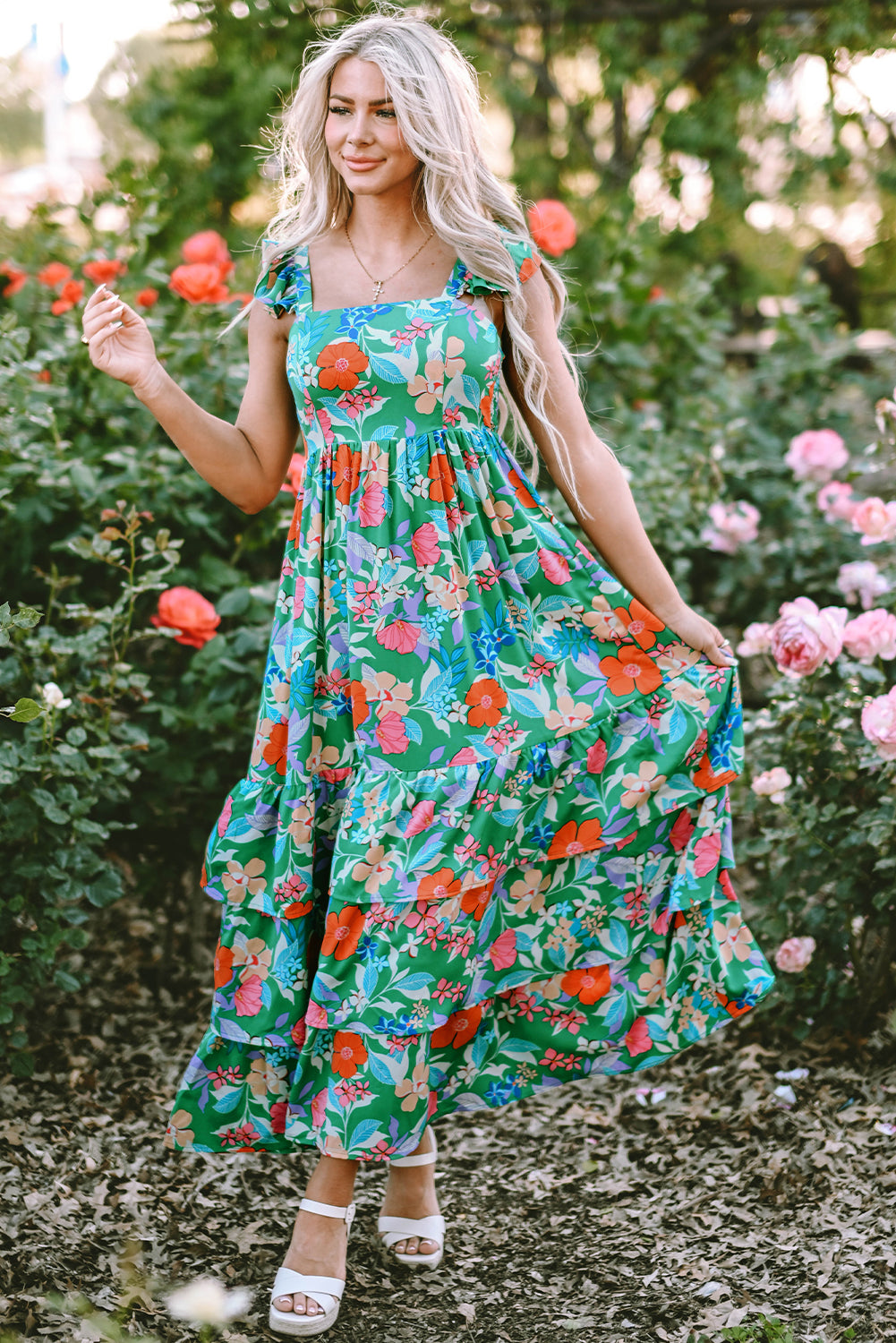 Pink sleeveless maxi dress with floral print and ruffles