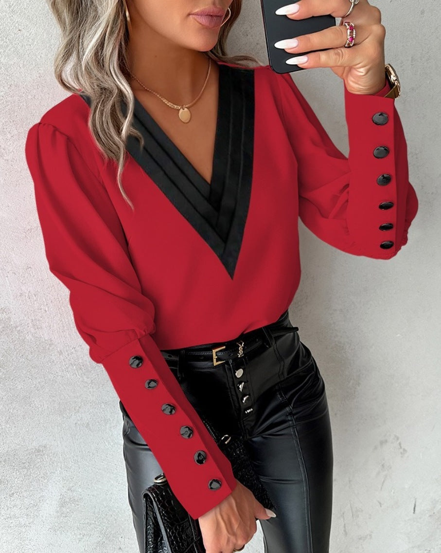 Fashionable V-neck blouse with long sleeves and button details