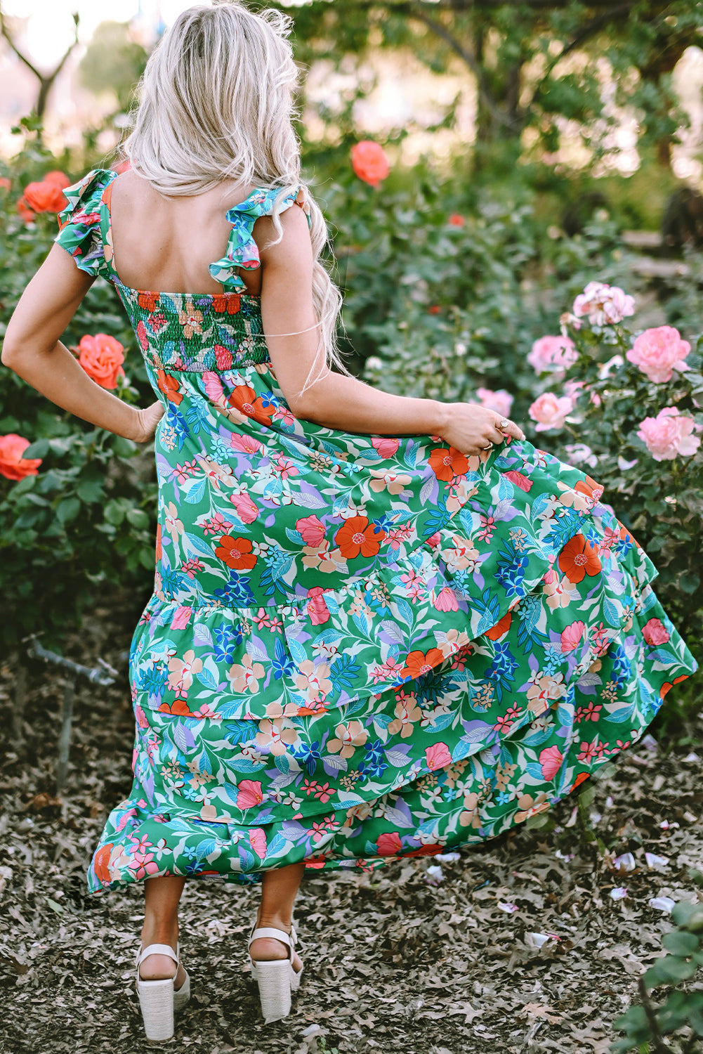 Pink sleeveless maxi dress with floral print and ruffles