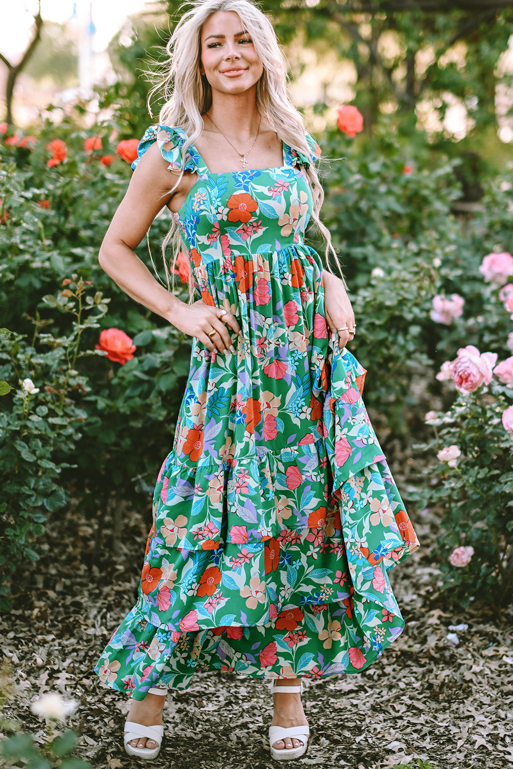 Pink sleeveless maxi dress with floral print and ruffles