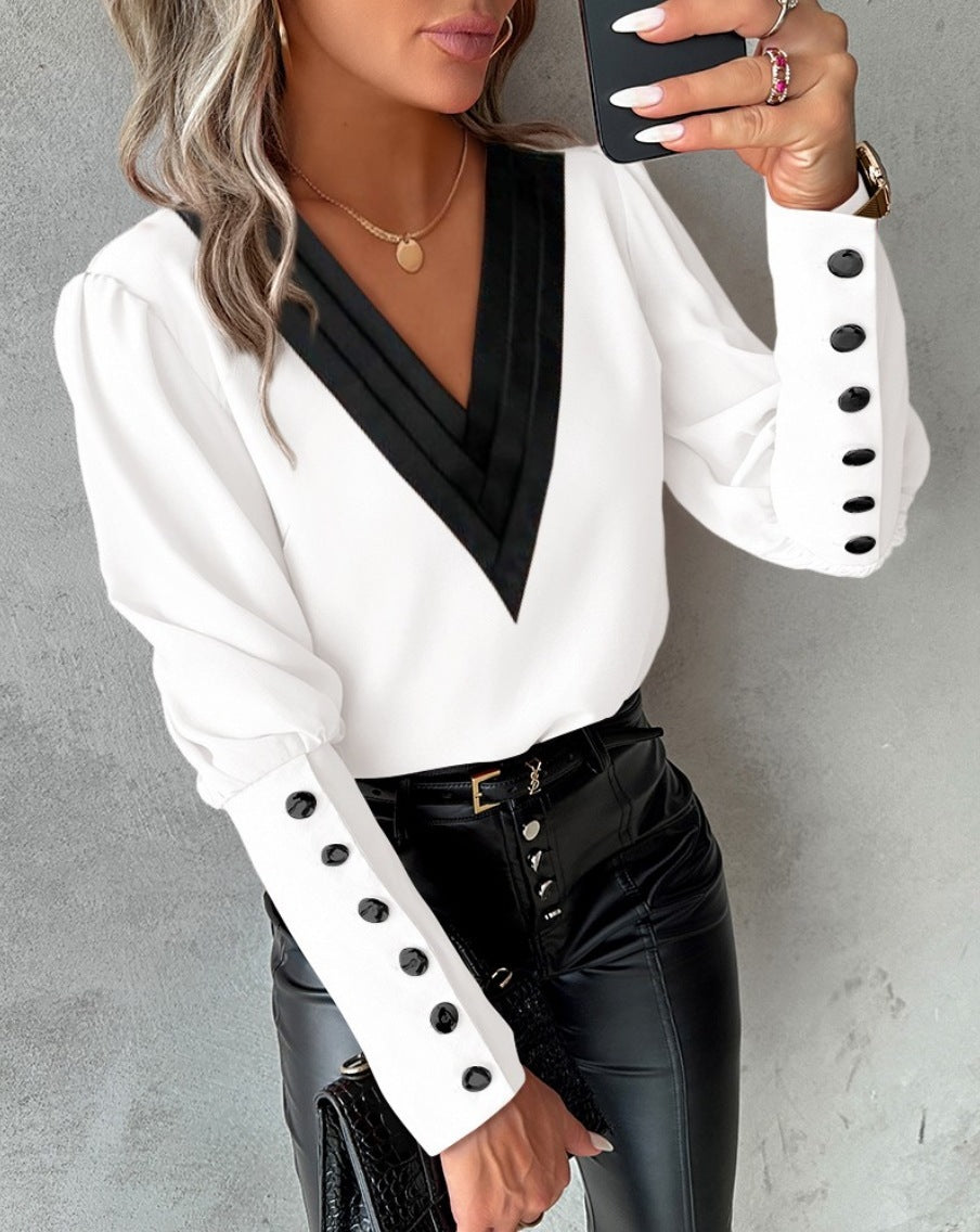 Fashionable V-neck blouse with long sleeves and button details