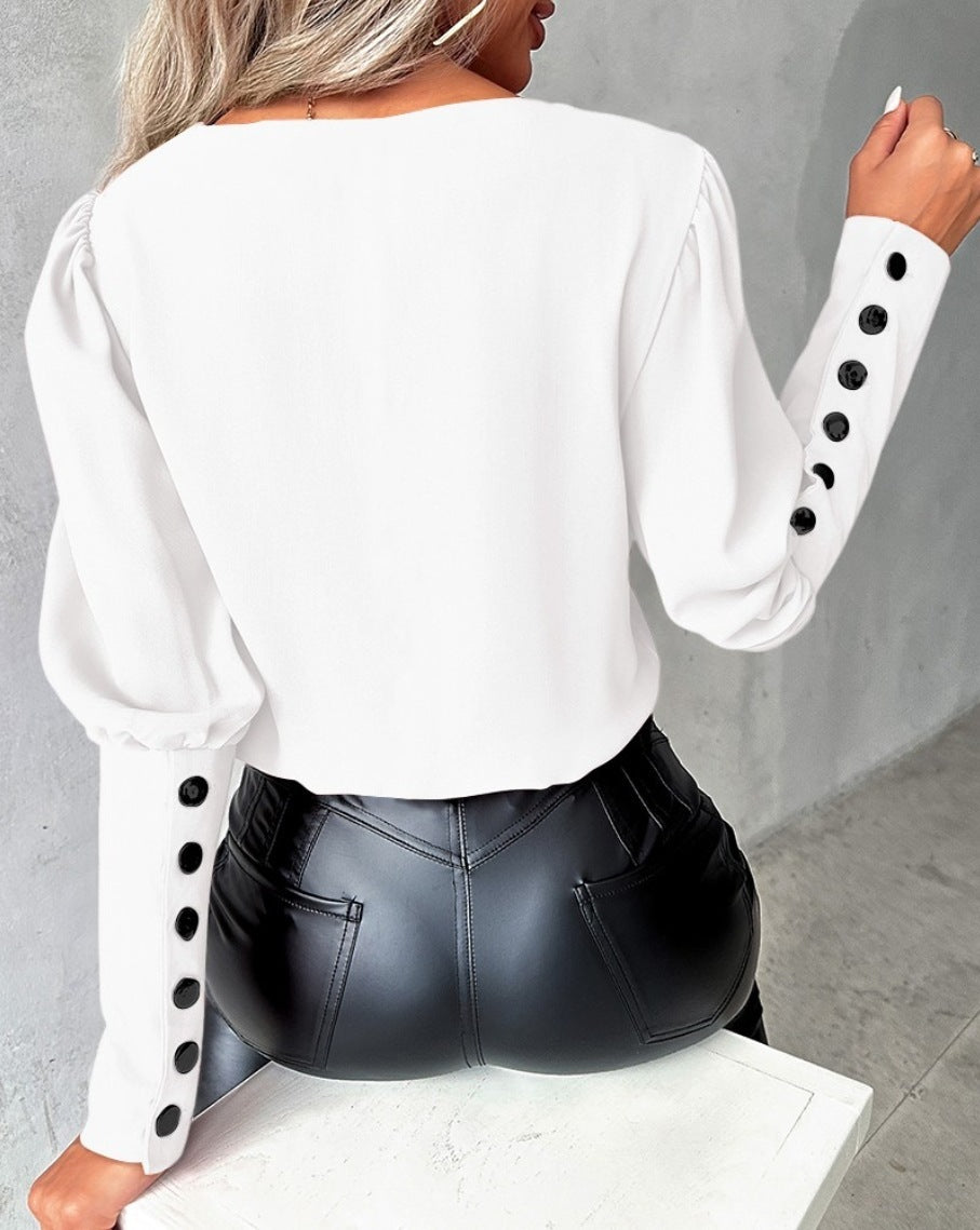 Fashionable V-neck blouse with long sleeves and button details