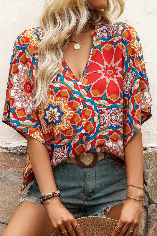 Red blouse with v-neck and a floral print