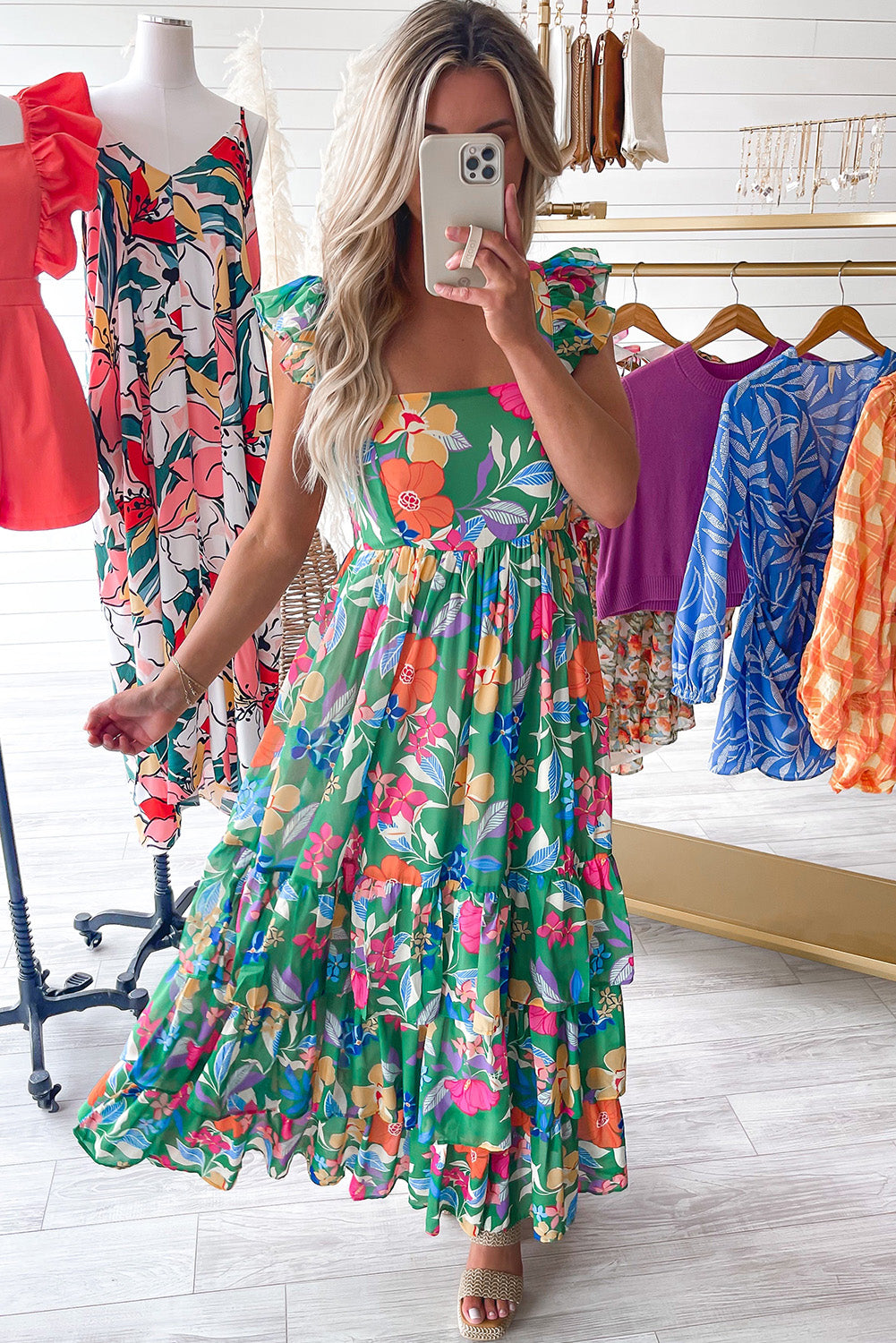 Pink sleeveless maxi dress with floral print and ruffles