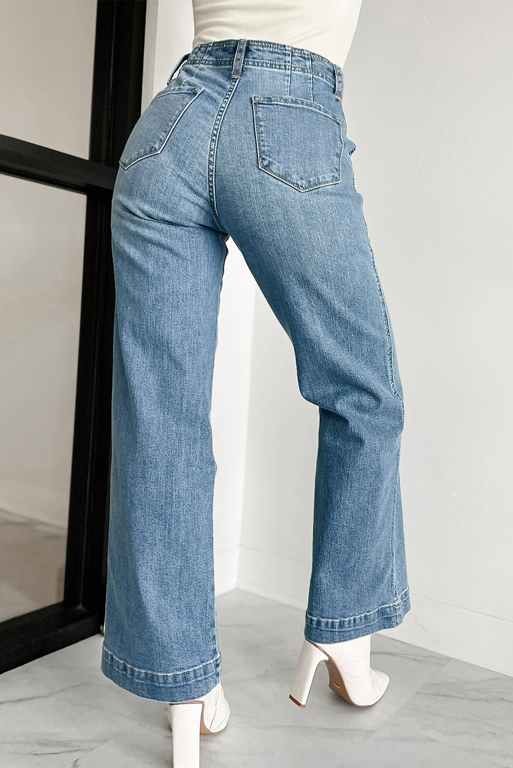 Dark blue jeans with multiple buttons