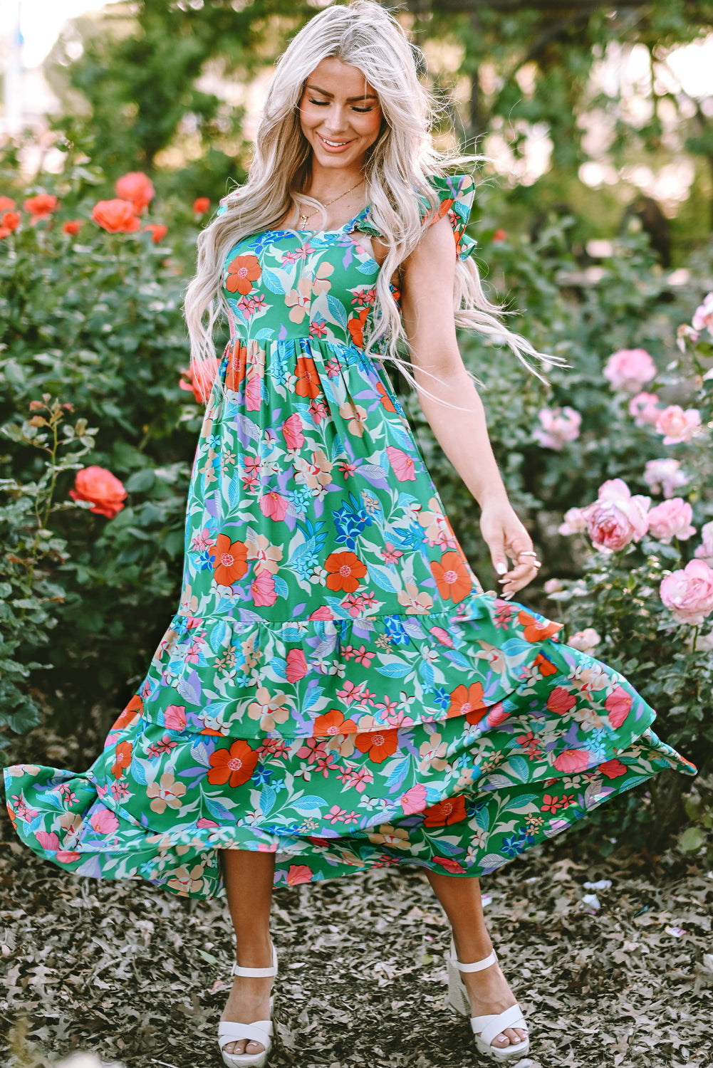 Pink sleeveless maxi dress with floral print and ruffles