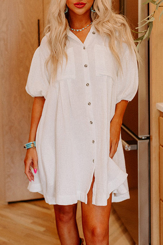 White mini dress with button closure and half puff sleeves