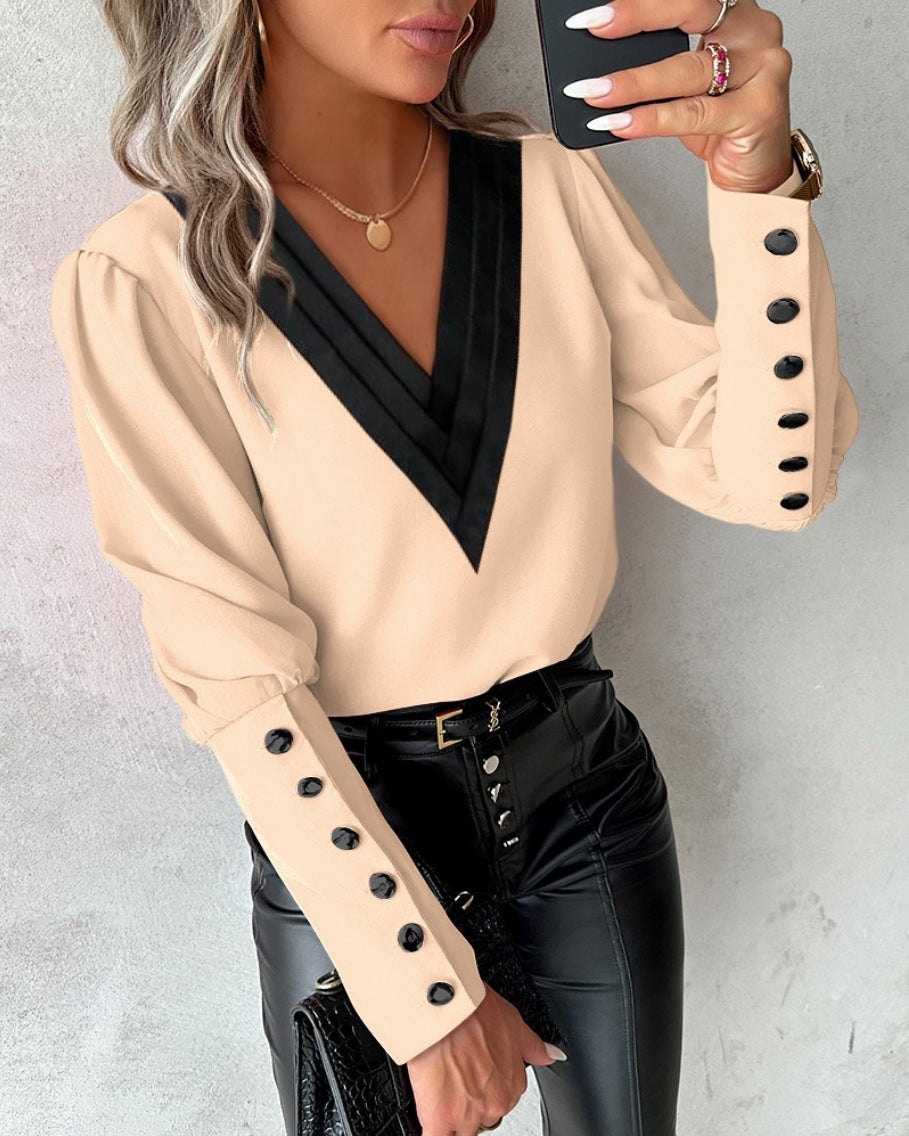 Fashionable V-neck blouse with long sleeves and button details