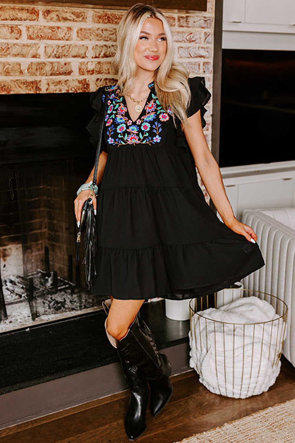 Black mini dress with embroidered flowers and layered ruffles