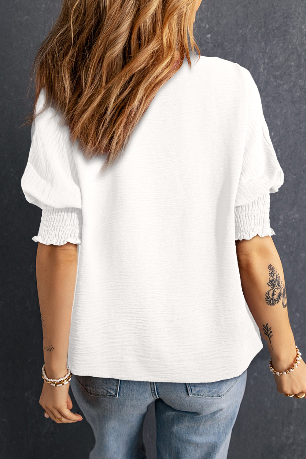 White boxy blouse with collar and smocked sleeve cuffs