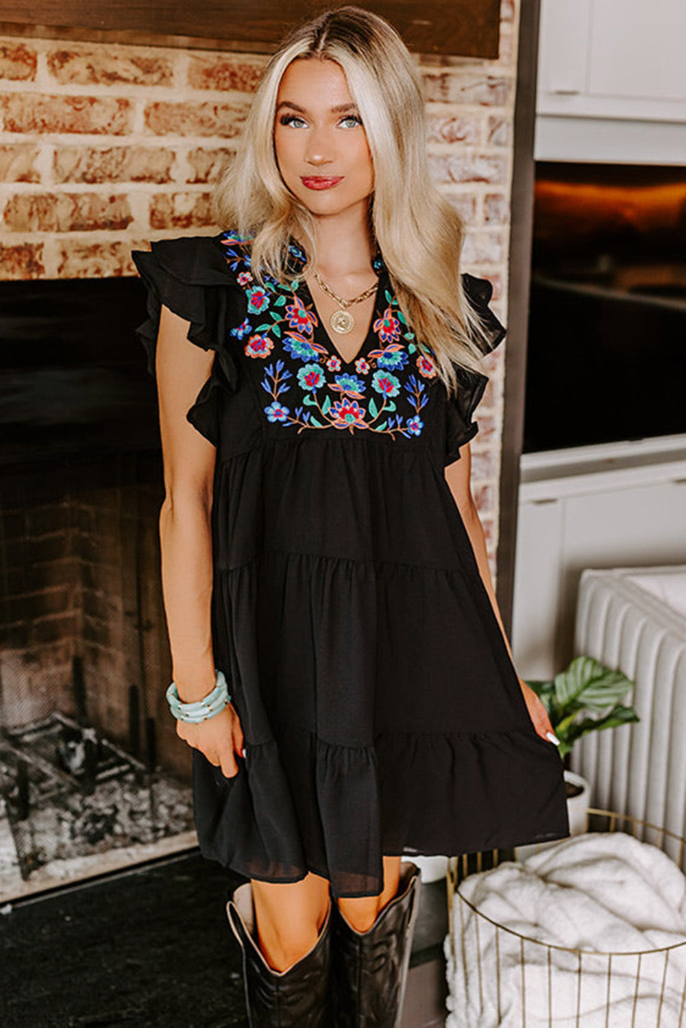 Black mini dress with embroidered flowers and layered ruffles